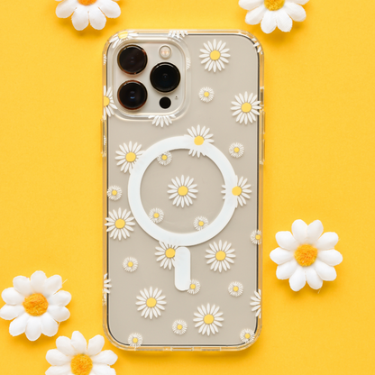 Clear MagSafe phone case with white and yellow daisy pattern, shown on a yellow background.