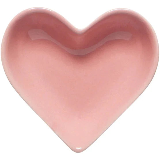 Pink heart-shaped object on a white background