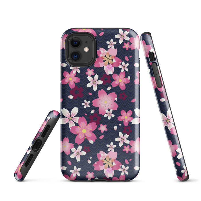 Sakura kawaii iPhone tough case with a print of drifting cherry blossom petals and golden wave arcs